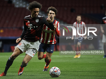 Leroy Sane of Bayern and Joao Felix of Atletico Madrid compete for the ball during the UEFA Champions League Group A stage match between Atl...
