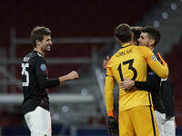 Thomas Muller of Bayern greets Jan Oblak of Atletico Madrid after the UEFA Champions League Group A stage match between Atletico Madrid and...