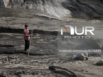 Villagers of Sumbersari walks on the Besuk Kobokan river which full of volcanic materials fom the eruption of mount Semeru (3.676 masl) in S...