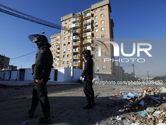 Police patrol during an intervention in an illegal cannabis plantation in a building located in the Almanjayar neighborhood in Granada, Spai...