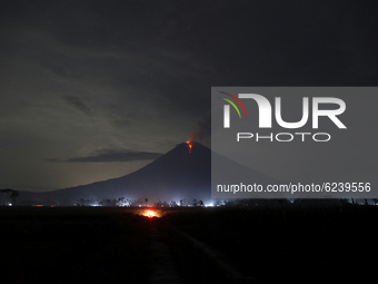 Night view of the volcanic activity from the summit creaters of mount Semeru during its eruption as seen from Lumajang subdistrict, East Jav...