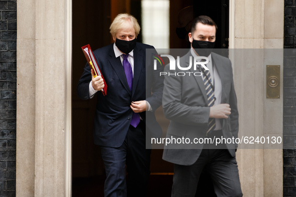 British Prime Minister Boris Johnson, Conservative Party leader and MP for Uxbridge and South Ruislip, wears a face mask leaving 10 Downing...
