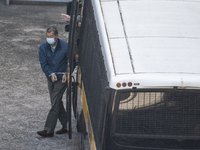 Jimmy Lai is seen handcuffed as he exits a prison van at Lai Chi Kok Reception Center on December 3, 2020 in Hong Kong, China. Jimmy lai was...
