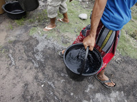 Villagers of Sumbersari receive a clean water assistance from the Indonesian National Disaster Management Agency, Lumajang subdistrict, East...