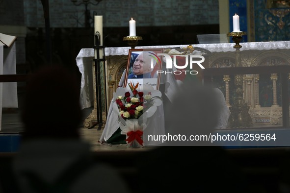 A picture shows a portrait of late Algerian Archbishop Henri Tessier on December 9, 2020 during a mass in his honour in Algiers. Tessier die...