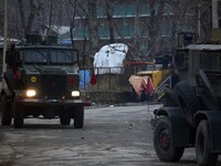 Indian army vehicles near the gun-battle site in Tiken village of Pulwama Kashmir on December 09, 2020.Three militants were killed and a civ...
