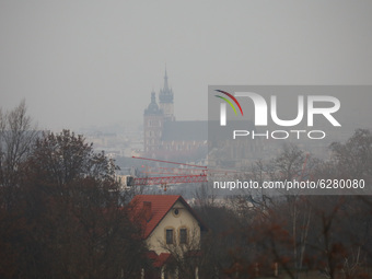 A view over the city of Krakow and St. Mary's Basilica from Krakus Mound during smog standards many times exceeded. Krakow, Poland on Decemb...