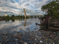 A man rows a boat on the Siak river which is covered by plast waste in Pekanbaru., Riau Province, Indonesia, Dec 17, 2020.
The accumulation...