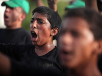 Palestinians Boy take part in a military-style exercise at a summer camp organized by Hamas movement in Gaza City June 7, 2015. Tens of thou...
