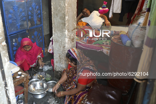 Three generation of a family live in a small room in  Korail slum at Dhaka Bangladesh on December 21, 2020.  