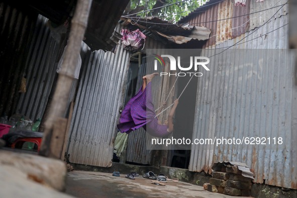 Children are living in a unhealthy environment in  Korail slum at Dhaka Bangladesh on December 21, 2020. 