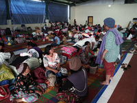 An image available on June 8, 2015, Villagers rest in temporary shelters after they were evacuated from the memorial raised to the highest l...