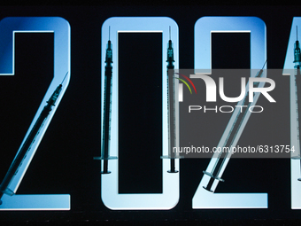 An illustrative image of medical syringes in front of 2021 image displayed on a screen.
On Thursday, December 31, 2020, in Dublin, Ireland....