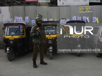 An Indian paramilitary trooper stands alert during shutdown against killing of three alledged Kashmiri militants in Srinagar, Indian Adminis...