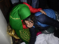 Family members of slain non local gold smith wail over his dead body at his  residence in Srinagar, Indian Administered Kashmir on 01 Januar...