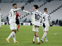 Paulo Dybala of Juventus celebrates with Danilo after scoring their team's fourth goal during the Serie A match between Juventus and Udinese...