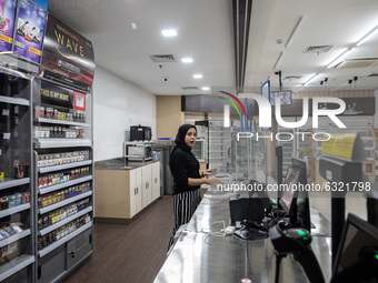 A woman waiting for customer at a store in the mall in Jakarta, Indonesia, on January, 4, 2021. Situation at A Mall in Jakarta that impacted...
