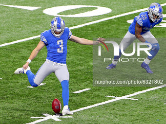 Detroit Lions punter Jack Fox (3) kicks during the first half of an NFL football game between the Detroit Lions and the Minnesota Vikings in...