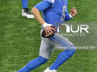Detroit Lions quarterback Matthew Stafford (9) runs the ball during the first half of an NFL football game between the Detroit Lions and the...