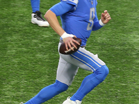 Detroit Lions quarterback Matthew Stafford (9) runs the ball during the first half of an NFL football game between the Detroit Lions and the...