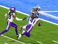 Detroit Lions wide receiver Mohamed Sanu (12) blocks the pass intended for Minnesota Vikings free safety Anthony Harris (41) during the firs...