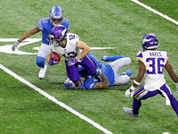 Minnesota Vikings wide receiver Chad Beebe (12) is taken down by Detroit Lions cornerback Mike Ford (38) during the first half of an NFL foo...