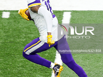 Minnesota Vikings wide receiver Justin Jefferson (18) carries the ball during the second half of an NFL football game between the Detroit Li...