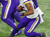 Minnesota Vikings running back Alexander Mattison (25) carries the ball during the second half of an NFL football game between the Detroit L...