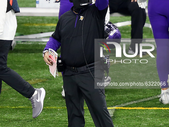 Minnesota Vikings head coach Mike Zimmer gestures from the sidelines during the second half of an NFL football game between the Detroit Lion...