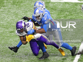 Minnesota Vikings wide receiver Justin Jefferson (18) is tackled by Detroit Lions outside linebacker Christian Jones (52) during the second...