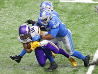 Minnesota Vikings wide receiver Justin Jefferson (18) is tackled by Detroit Lions outside linebacker Christian Jones (52) during the second...