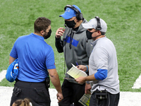Detroit Lions head coach Darrell Bevell talks with coaching staff during the second half of an NFL football game between the Detroit Lions a...