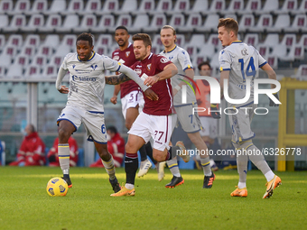 Adrian Tameze of Hellas Verona FC and Karol Linetty of Torino FCduring the Serie A football match between Torino FC and Hellas Verona FC at...
