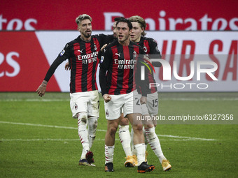 Milan defender Davide Calabria (2) celebrates with his teammates after scoring his goal to make it 1-1 during the Serie A football match n.1...