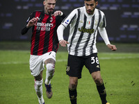 Juventus defender Gianluca Frabotta (38) fights for the ball against Milan midfielder Samu Castillejo (7) during the Serie A football match...