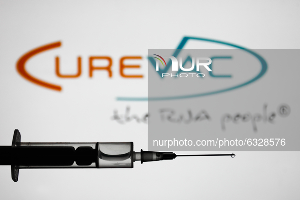 Medical syringe is seen with CureVac logo displayed in the background in this illustration photo taken in Poland on January 7, 2021. Bayer a...