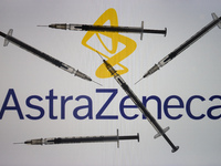 An illustrative image of medical syringes in front of AstraZebeca logo displayed on a screen.
On Friday, January 8, 2020, in Dublin, Ireland...
