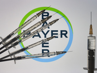 An illustrative image of medical syringes in front of Bayer logo displayed on a screen.
On Friday, January 8, 2020, in Dublin, Ireland. (