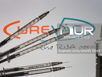 An illustrative image of medical syringes in front of CureVac logo displayed on a screen.
On Friday, January 8, 2020, in Dublin, Ireland. (
