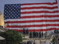 Police formed along a flag that Trump supporters issue in US Capitol,  on January 06, 2021 in Washington, DC. The protesters stormed the his...