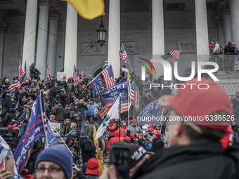 Trump supporters take the steps on the east side of the US Capitol building on January 06, 2021 in Washington, DC. The protesters stormed th...
