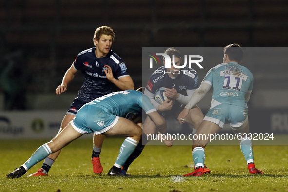 Sales Tom Roebuck is tackled by Worchester players      during the Gallagher Premiership match between Sale Sharks and Worcester Warriors at...