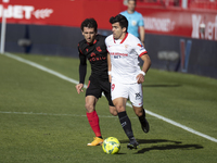 Mikel Oyarzabal of Real Sociedad in action with Marcos Acuna of Sevilla FC during the La Liga match between Sevilla FC and Real Sociedad at...