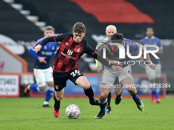 Oldham Athletic's Ben Garrity tussles with Gavin Kilkenny of Bournemouth  during the FA Cup match between Bournemouth and Oldham Athletic at...