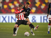  Marcus Forss of Brentford and Nathan Wood of Middlesbrough battle for the ball during the FA Cup match between Brentford and Middlesbrough...