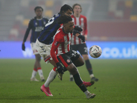  Tariqe Fosu of Brentford and Djed Spence of Middlesbrough battle for the ball during the FA Cup match between Brentford and Middlesbrough a...