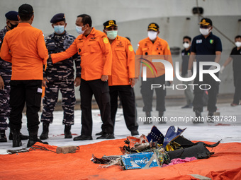 Debris and cloth from passenger at the harbour. Cooperative rescue from Indonesia Millitary, Indonesia Search and rescue in finding debris a...