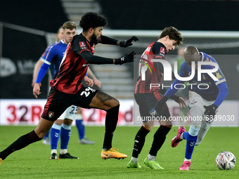  Oldham Athletic's Dylan Bahamboula tussles with Gavin Kilkenny of Bournemouth and Philip Billing of Bournemouth during the FA Cup match bet...