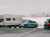 police car is seen patroling the area as more and more people come to enjoy the snow covered field in Ramersbach (