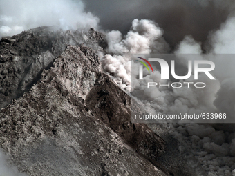 Mount Sinabung spews volcanic ash smoke pouring from the crater hole after the increase in activity to the alert level raised to the level o...